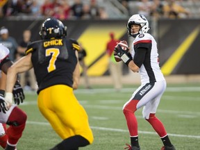 Ottawa Redblacks quarterback Trevor Harris sets to throw during CFL action against the Hamilton Tiger-Cats in Hamilton on Aug. 18, 2017. (THE CANADIAN PRESS/Peter Power)