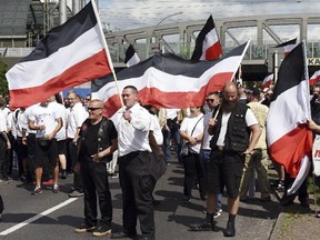Far-right extremists gather to commemorate the death of Adolf Hitler's deputy, Rudolf Hess, in Berlin's western district of Spandau on Saturday, Aug. 19, 2017. (Maurizio Gambarini/dpa via AP)