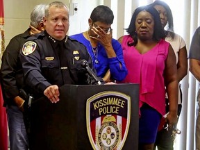 Kissimmee Police Chief Jeff O'Dell (left) holds a news conference on Saturday, Aug. 19, 2017 in Kissimmee, Fla. The Kissimmee Police Department says Sgt. Sam Howard died Saturday from his injuries. His colleague, Officer Matthew Baxter, died Friday night after an attack. (Red Huber/Orlando Sentinel via AP)
