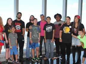 World Wrestling Entertainment superstars pose with Make-A-Wish recipients on the 102nd floor of One World Observatory in New York City on Saturday. Dana Warrior, left to right, Seth Rollins, AJ Styles, Dolph Ziggler and Nikki Bella surprised the children and their families during a tour at the former site of the World Trade Center. (George Tahinos/SLAM! Wrestling)