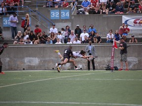 A member of the Toronto Wolfpack dives for the goal line during yesterday’s win over the Newcastle Thunder. (WOLFPACK PHOTO)