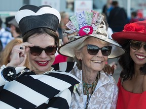 (from left) Laura Dreger won 1st prize, Elizabeth Graham won 3rd and Robi Adawiya too second with their stylish hats at the 88th running of the Canadian Derby at Northlands park in Edmonton on Saturday Aug. 19, 2017. (Photo by John Lucas/for the Edmonton Journal) Photos for coverage of Canadian Derby in Sunday, Aug. 20 edition.