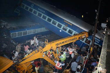 Emergency workers look for survivors on the wreckage of a train carriage after an express train derailed near the town of Khatauli in the Indian state of Uttar Pradesh on August 19, 2017. (Getty Images)