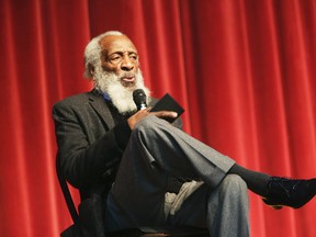 In this Jan. 20, 2016 file photo, long time civil rights activist, writer, social critic, and comedian Dick Gregory, talks to the crowd at the 16th annual Tampa Bay Black Heritage Festival, MLK Leadership Luncheon, at the University Area Community Development Center, in Tampa, Fla. (Scott Keeler /Tampa Bay Times via AP)