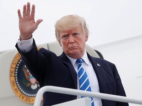 U.S. President Donald Trump waves as he boards Air Force One at Hagerstown Regional Airport in Hagerstown, Md., Friday, Aug. 18, 2017. The U.S. appears to be signalling that President Donald Trump's vow to aggressively promote a "buy American, hire American" agenda is not open to discussion during negotiations on a new North American Free Trade Agreement. (Pablo Martinez Monsivais/AP Photo)
