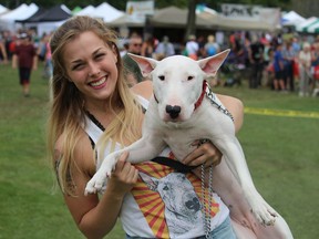 Mikayla Davis and her dog Hailey, with a shirt to match, attended the ninth annual Pawlooza in London on Saturday. (CHARLIE PINKERTON/THE LONDON FREE PRESS/POSTMEDIA NETWORK)