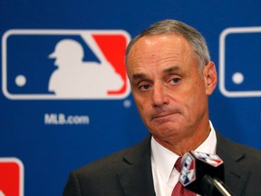 Baseball Commissioner Rob Manfred listens to a question following the two-day meeting of Major League Baseball owners, Thursday, Aug. 17, 2017, in Chicago. (AP Photo/Charles Rex Arbogast)