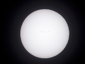 The sun, shown here shot through a white light solar filter, shows a series of sun spots as seen from Salem, Ore., Sunday, Aug. 20, 2017. Salem is in the path of totality for the solar eclipse Monday, Aug. 21. (AP Photo/Don Ryan)