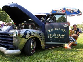 Ace Dafoe of Shannonville gets a little shade from an umbrella attached to his heavily-modified 1951 Chevy truck at the Belleville Lions Club 7th annual Show and Shine car show at West Zwick's Park on Sunday August 20, 2017 in Belleville, Ont. Tim Miller/Belleville Intelligencer/Postmedia Network