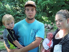 The Badour family, from left, Scyler junior, father Scyler, baby girl Taylee and mother Tiffany, at their Battersea home on Friday. (Steph Crosier/The Whig-Standard)