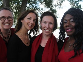 From left, Nicole Szumlanski, Julie Plaza, Rachel Burnett and Teaisha Whittingham of the Kingston Canadian Military Wives Choir on Saturday. (Steph Crosier/The Whig-Standard)