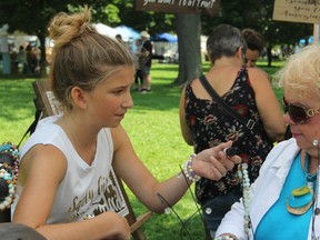 Jorja Majury, 13, creator of Saucy Girl Accessories, was the youngest vendor at the Kingston Women's Art Festival at City Park on Sunday. (Steph Crosier/The Whig-Standard)