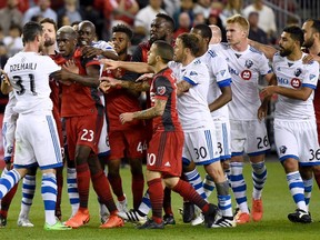 Things tend to get heated when Toronto FC squares off with 401 Derby rival, the Montreal Impact, like during this scuffle in June. (THE CANADIAN PRESS)
