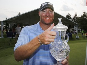 Mark Blakefield poses with a trophy after his first victory on the Mackenzie Tour – PGA Tour Canada at the Hylands Golf Club on Sunday, August 20, 2017. (Patrick Doyle)