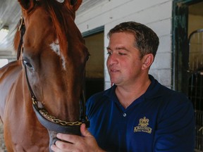 Trainer Kevin Attard, shown here with Melmich, was mourning the loss Saturday of another one of his favourite horses, Calgary Cat. (Dave Thomas/Toronto Sun/Postmedia Network)