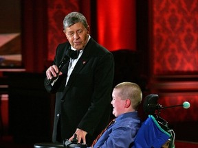 LAS VEGAS - SEPTEMBER 02:  Entertainer Jerry Lewis (L) speaks with Muscular Dystrophy Association goodwill ambassador Luke Christie during the 42nd annual Labor Day Telethon to benefit the MDA at the South Point Hotel & Casino September 2, 2007 in Las Vegas, Nevada.  (Photo by Ethan Miller/Getty Images)