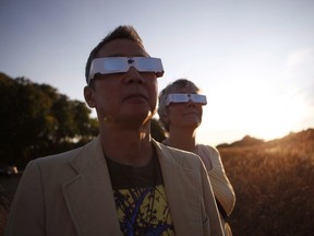 Clayton Uyeda and his wife Jo will be enjoying the partial eclipse while traveling from Swartz Bay to Tsawwassen ferry terminal on the mainland. The couple are photographed along Dallas Rd. in Victoria, B.C., on Friday, August 18, 2017. THE CANADIAN PRESS/Chad Hipolito