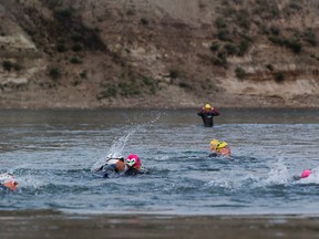 The Element triathlon club takes off on one of their regular swims in the North Saskatchewan River on Wednesday August 16, 2017, in Edmonton. Greg Southam / Postmedia