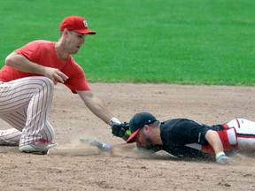 Jason Thibeault of the Underdogs barely beats the tag at second base during action against the Wolfpack from the six-team Elite division of the 40th Mitchell Grizzlies slo-pitch tournament last Saturday, Aug 19. ANDY BADER/MITCHELL ADVOCATE