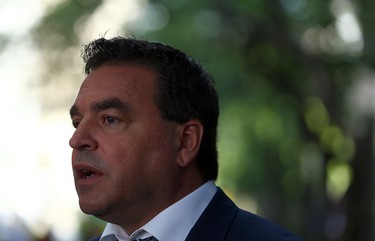 Councillor Giorgio Mammoliti speaks against the site as a safe injection site is set to open near Yonge/Dundas Sq. in Toronto on Monday August 21, 2017. (Dave Abel/Toronto Sun)