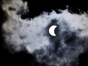 The moon travels left in front of the sun during the solar eclipse at 1:51 p.m. in London, Ont. on Monday August 21, 2017. (DEREK RUTTAN, The London Free Press)