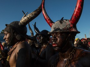 Revelers participate in Jouvert, an annual Caribbean street festival, celebrated each Labor Day September 7, 2015 in the Brooklyn borough of New York City. Jouvert starts the night before Carnival and leads into the main West Indies Day Parade. Some participants cover themselves with motor oil.(Photo by Stephanie Keith/Getty Images)