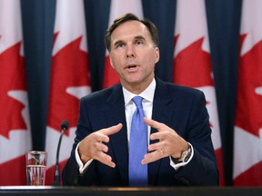Minister of Finance Bill Morneau holds a press conference at the National Press Theatre in Ottawa on Tuesday, July 18, 2017. (THE CANADIAN PRESS/Sean Kilpatrick)