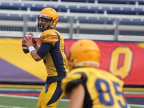 Queen's Golden Gaels quarterback Kyle Gouveia looks for Connor Weir during the second half of an exhibition university football game against the McGill Redmen at Richardson Stadium on Saturday. Queen's won 38-24. (Steph Crosier/The Whig-Standard)