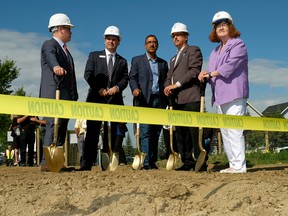 Scott Russill (Board Chair, Capital Region Housing), Greg Dewling (CEO, Capital Region Housing), Amarjeet Sohi (MP, Edmonton-Mill Woods), Curtis Way (right, President & CEO, RMS Group Inc.) and Denise Woolard (MLA, Edmonton-Mill Creek) at the ground turning ceremony for Pine Creek, a 174-unit apartment building and first partnership of its kind with Capital Region Housing, that will allow affordable housing to be integrated into regular market housing. Larry Wong/Postmedia