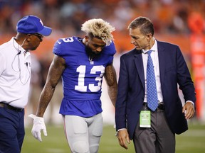 Odell Beckham Jr. of the New York Giants walks off the field after suffering an injury in the first half of a preseason game against the Cleveland Browns at FirstEnergy Stadium on Aug. 21, 2017. (Joe Robbins/Getty Images)