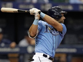 Tampa Bay Rays' Kevin Kiermaier hits a single on Aug. 20, 2017. Kiermaier has returned from the disabled list, providing the possibility of many more highlight-reel defensive plays from the Rays outfielder. (CHRIS O'MEARA/AP)