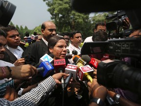 Farha Faiz, a Supreme Court lawyer, speaks to media after the apex court declared "Triple Talaq", a Muslim practice that allows men to instantly divorce their wives, unconstitutional in its verdict, in New Delhi, India, Tuesday, Aug. 22, 2017. (AP Photo/Altaf Qadri)