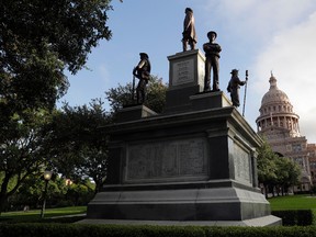 In this Monday, Aug. 21, 2017, photo, the Texas State Capitol Confederate Monument stands on the south lawn in Austin, Texas. (AP Photo/Eric Gay)