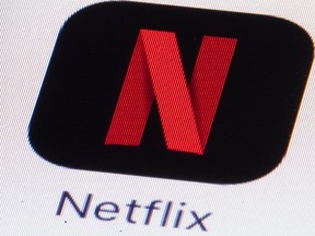 This Monday, July 17, 2017, file photo shows the Netflix logo on an iPhone in Philadelphia. Much of the attention showered on Netflix focuses on its insatiable appetite for original content. But this streaming network's multi-billion-dollar annual outlay for new programming necessitates another challenge: Matching each program with the subscribers who are likely to enjoy it. Netflix tags content, then identifies viewer habits. (AP Photo/Matt Rourke, File)