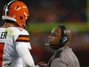 Cleveland Browns head coach Hue Jackson, right, talks with quarterback Brock Osweiler during an NFL pre-season game against the New York Giants on Aug. 21, 2017. (AP Photo/Ron Schwane)