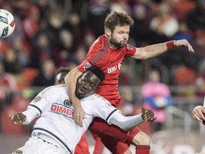 Toronto FC’s Drew Moor battles for the ball with Philadelphia Union’s C.J. Sapong when the two teams met in the playoffs last year. (THE CANADIAN PRESS)