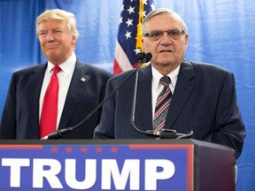 In this Jan. 26, 2016, file photo, then-Republican presidential candidate Donald Trump is joined by Joe Arpaio, the then sheriff of metro Phoenix, during a news conference in Marshalltown, Iowa. (AP Photo/Mary Altaffer, File)