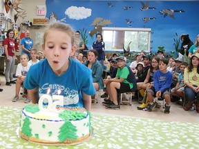 Gino Donato/Sudbury Star

Brielle Tremblay, a camper at Camp Bitobig, blows out the candles Tuesday on the 50th anniversary cake for the Lake Laurentian Nature Chalet in Sudbury. The Lake Laurentian Nature Chalet first opened on Aug. 22, 1967. Conservation Sudbury is inviting the public to share stories and memories about the Nature Chalet at www.facebook.com/ConservationSudbury/.