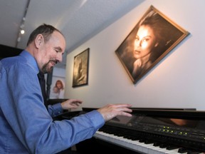 Photographer Con Boland plays is electronic piano at his Riverdale Home in Edmonton, Alberta on Friday Jan.23, 2015. Perry Mah/Postmedia
