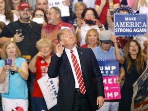 U.S. President Donald Trump gestures during a rally at the Phoenix Convention Center on August 22, 2017 in Phoenix, Arizona. (Photo by Ralph Freso/Getty Images)