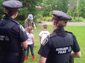 In this Facebook picture, Waterloo Regional Police officers take part in a community outreach event in a local park on August 23, 2017 in the Kitchener-Waterloo Region in Ontario. (Facebook/Waterloo Regional Police)