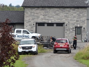 Kingston Fire and Rescue and Kingston Police on the scene of a fire that took place at about 5:30 a.m. on Accommodation Road in Kingston, Ont. on Wednesday August 23, 2017. Steph Crosier/Kingston Whig-Standard/Postmedia Network