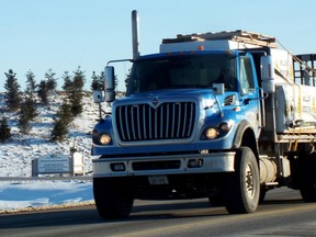 In this file photo, a truck passes the Twin Creeks Landfill near Watford. The site's owner, Waste Management, is seeking to expand the amount of waste it can accept daily, and host community, Warwick Township, wants the province to agree to have a full-time inspector there each day. (File photo)