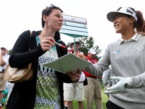 Lydia Ko giving an autograph during the Canadian Pacific Women's Open Championship Pro Am at the Ottawa Hunt and Golf Club on Aug. 23, 2017. (Tony Caldwell/Postmedia)
