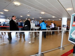 Passengers clear a Canadian Air Transport Security Authority (CATSA) security station at Winnipeg's James Armstrong Richardson International Airport in this  April 29, 2014 file photo. (Tom Braid/Postmedia Network File Photo)