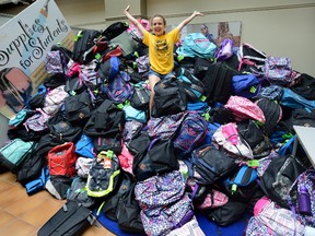 Lauren Goldsack, 12, was among the volunteers who prepared this mountain the school supplies at the Thames Valley District Education Centre for needy students. She donated several bags by asking guests to her birthday party to bring backpacks full of supplies instead of gifts. (MORRIS LAMONT, The London Free Press)