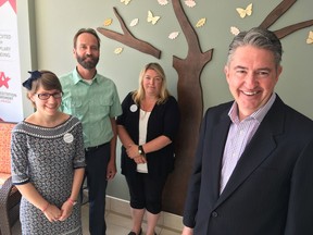 Kevin Jameson of the Dementia Society of America, right, stands with Fairmount Home recreationist Katie Johnson, from left, Frontenac County communications officer Marco Smits and Emily Shoniker, Fairmount Home's director of resident care. (Elliot Ferguson/The Whig-Standard)