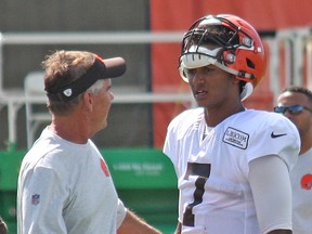 Browns quarterback DeShone Kizer (right) speaks with quarterbacks coach David Lee in Berea, Ohio. As a rookie, Kizer has performed well enough to earn the confidence of coaches. (John Krk/Postmedia Network)