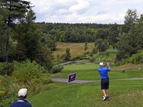 Glen Scott hits a shot from the ninth tee at the Sorcier Golf Club during the Ottawa Sun Scramble yesterday. (Jean Levac/Postmedia Netwok)