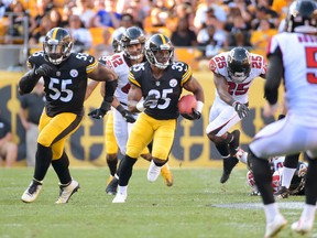 Steelers' Trey Williams (35) follows the block of Arthur Moats (55) after getting past Atlanta Falcons defenders Akeem King (25) and Duke Riley (42) to return the punt by punter Matt Bosher (5) for a touchdown during NFL preseason action in Pittsburgh on Sunday, Aug. 20, 2017. (Fred Vuich/AP Photo)